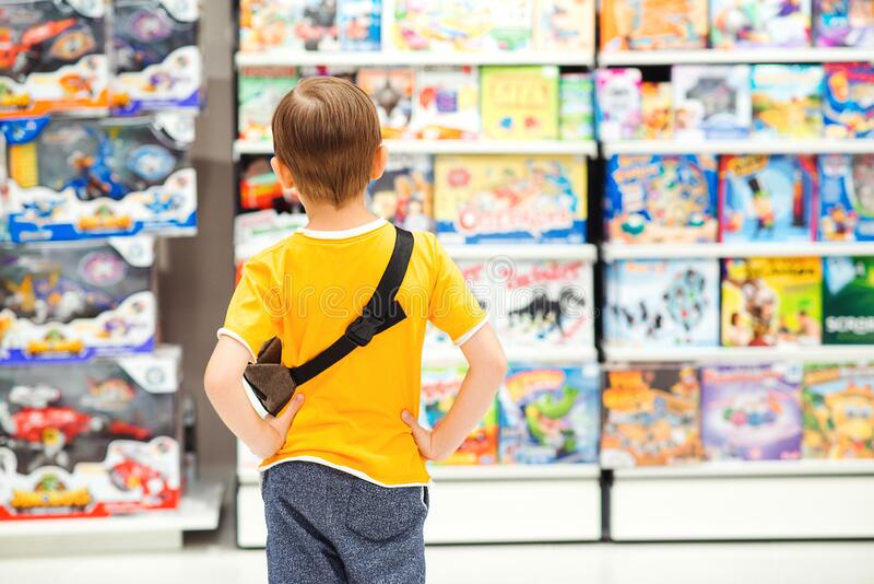little-boy-choosing-toys-birthday-gift-many-around-kids-shop-sales-discounts-shopping-cute-selecting-store-child-doing-182960101